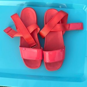 Ugg sandal women’s size 11 in coral.  Sandal has ribbon and velcro straps.